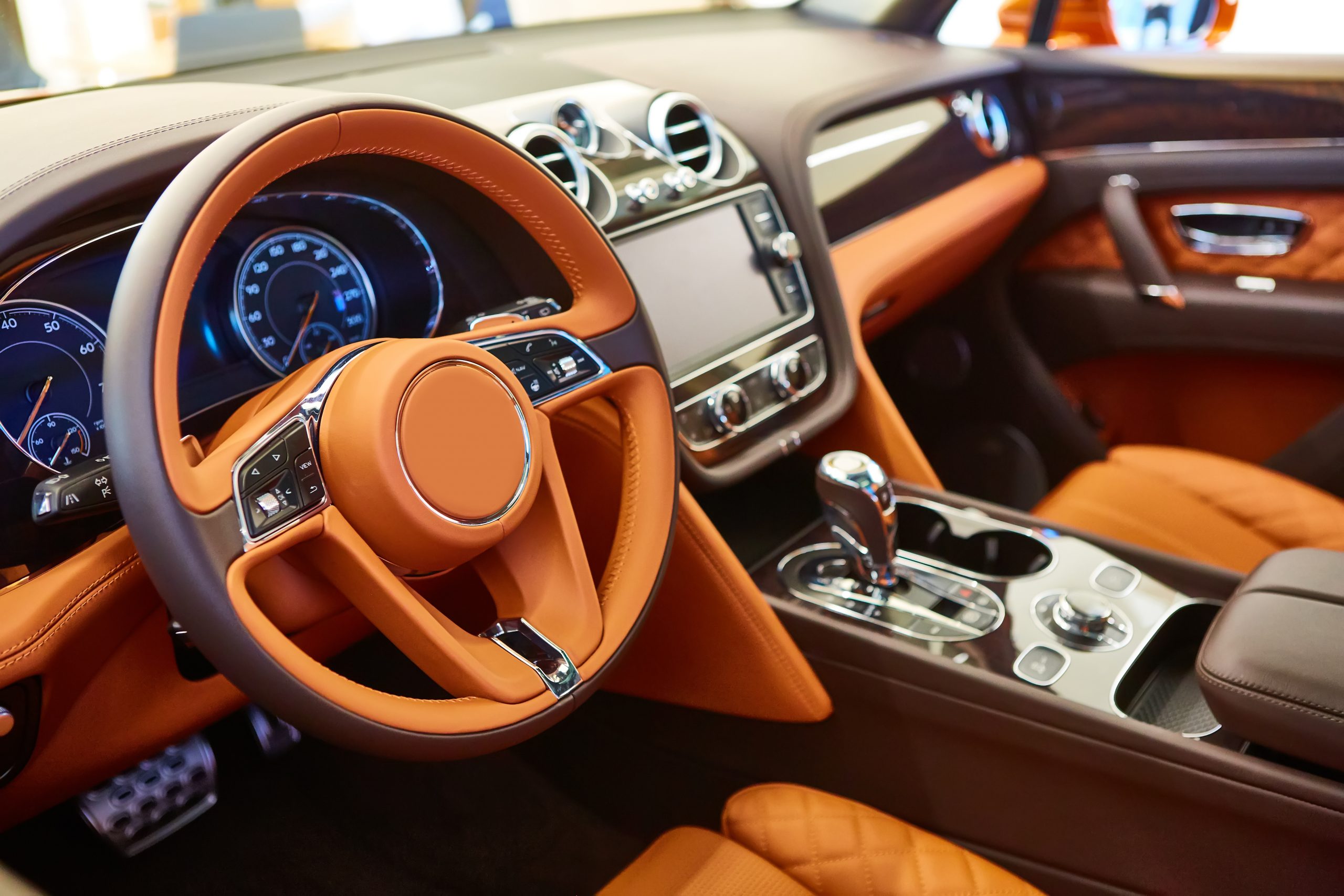 Modern car interior with leather panel, multimedia and dashboard