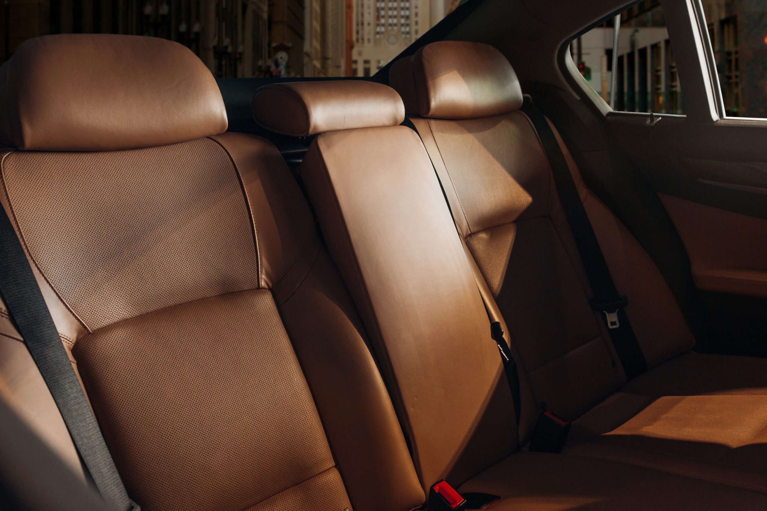 Cozy leather seats at the back row of a modern luxury sedan. Vip